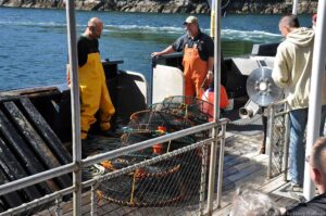 Ejecting the Prawn Traps back to the water.